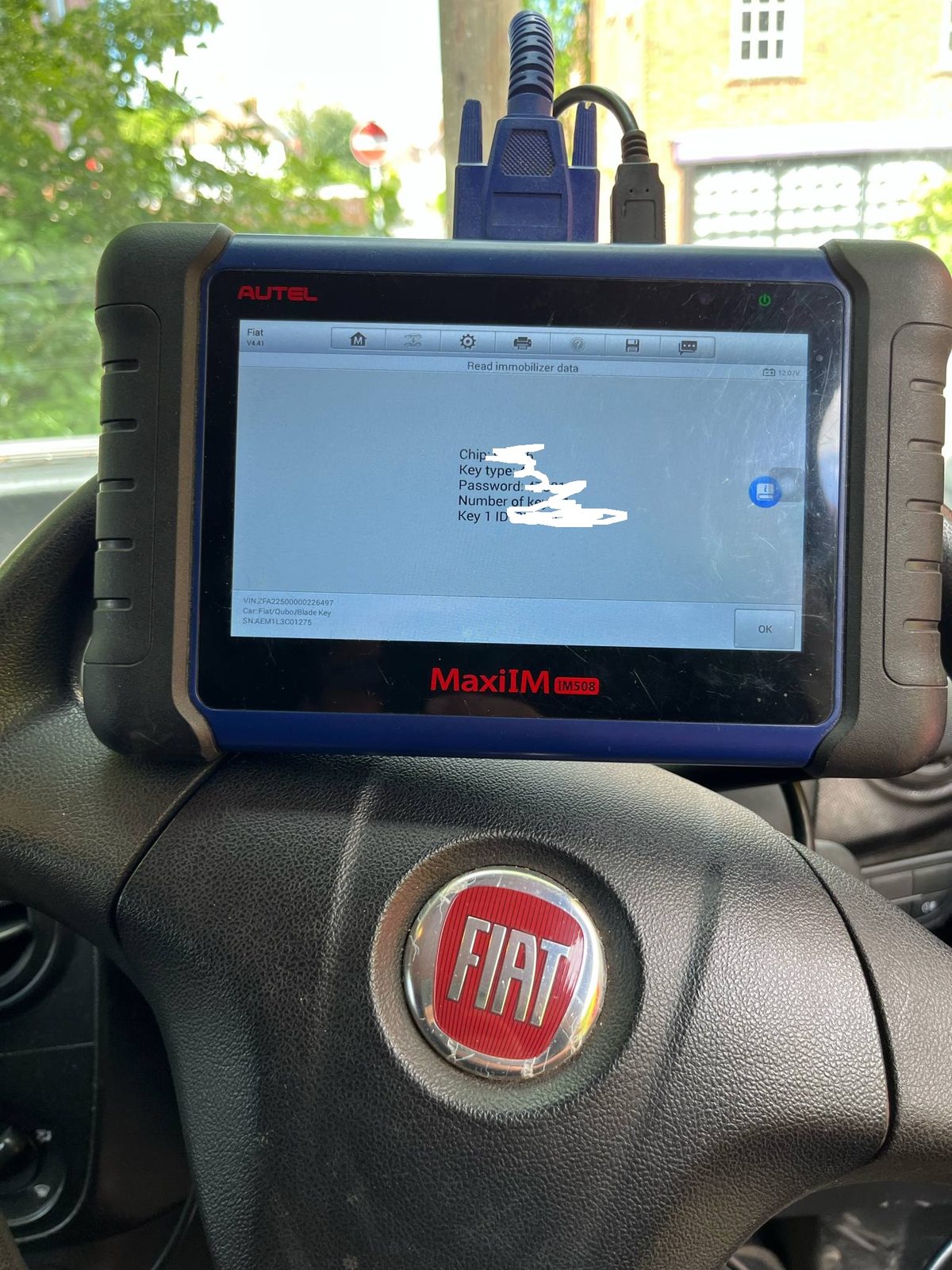 Diagnostic tablet connected inside a Fiat Fiorino during the all-keys-lost key programming job